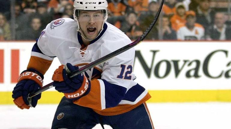 New York Islanders' Josh Bailey charges towards the puck during...