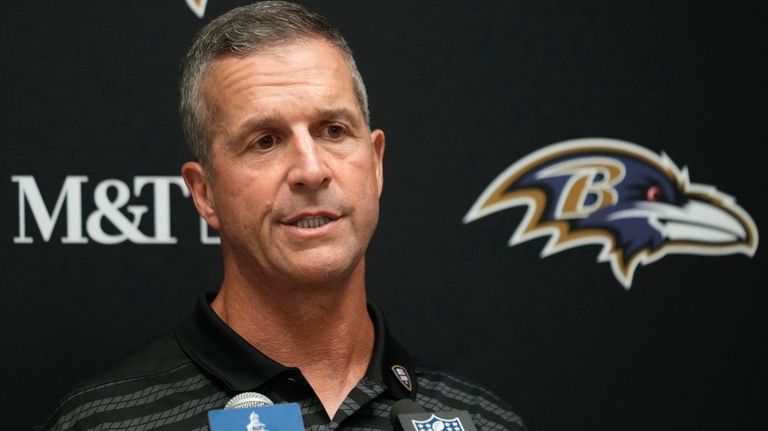 Baltimore Ravens head coach John Harbaugh speaks during a news...