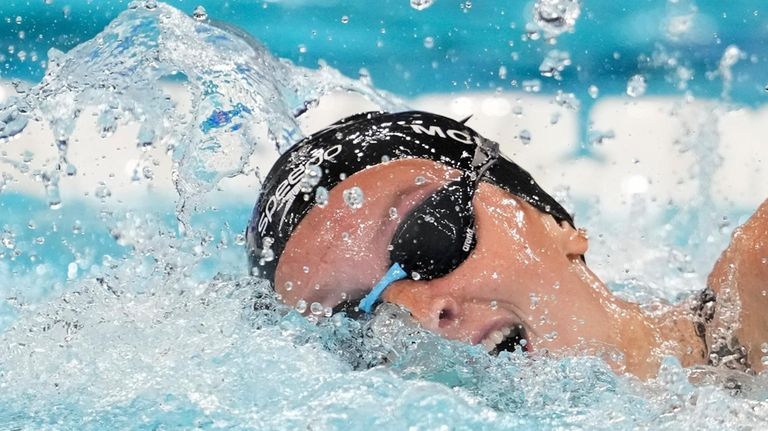 Summer McIntosh, of Canada, competes during a heat in the...