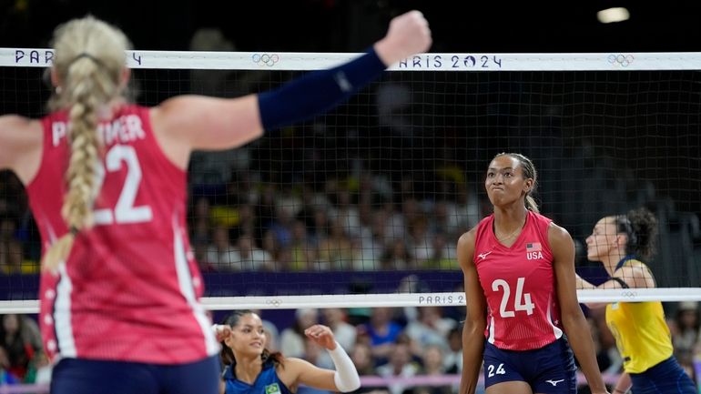 United States' Kathryn Plummer (22) and Chiaka Ogbogu (24) celebrate...