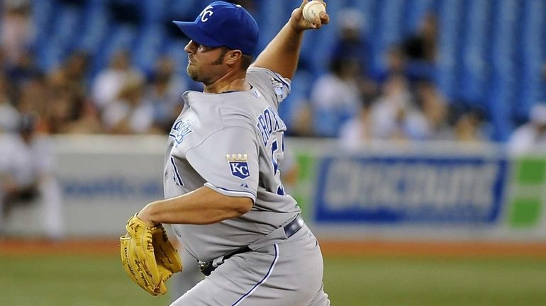 Jonathan Broxton of the Kansas City Royals delivers a pitch...