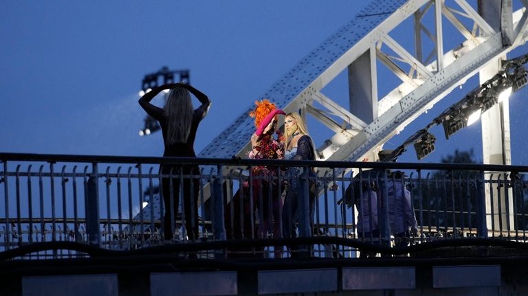 Drag queen Piche prepares to perform, at the Debilly Bridge...