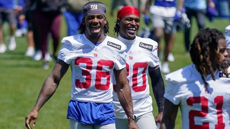 New York Giants cornerback Deonte Banks (36) walks back to...