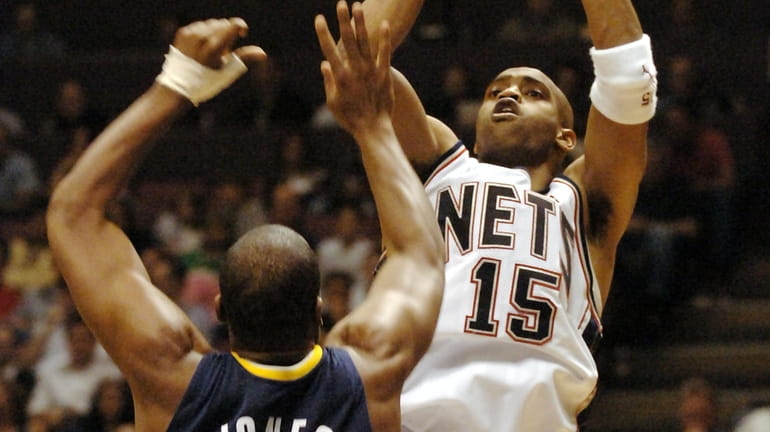The Nets' Vince Carter shoots a jump shot over the...