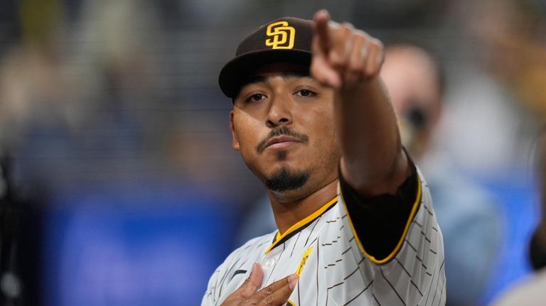 San Diego Padres relief pitcher Jeremiah Estrada celebrates after the...