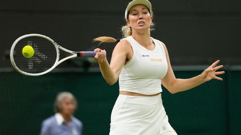 Danielle Collins plays a forehand return to Barbora Krejcikova of...