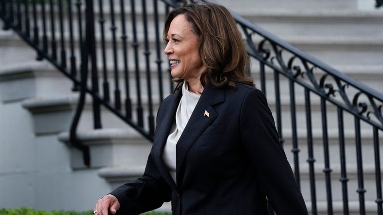 Vice President Kamala Harris walks back into the White House...