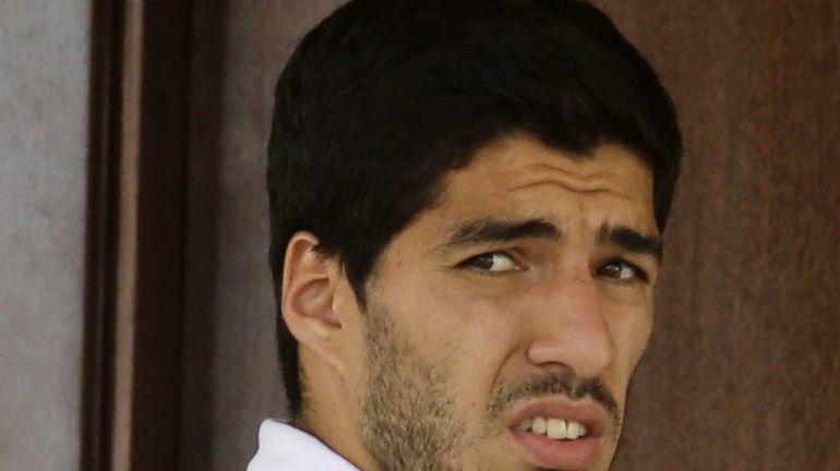 Uruguay's Luis Suarez looks out from his hotel in Natal,...