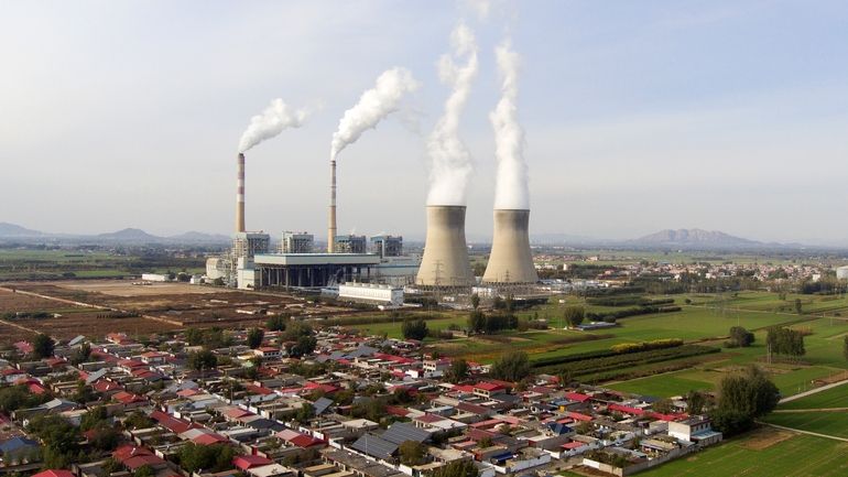 Guohua Power Station, a coal-fired power plant, operates in Dingzhou,...