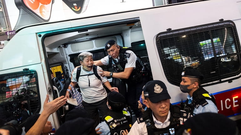 Police officers detained a resident in Causeway Bay area on...