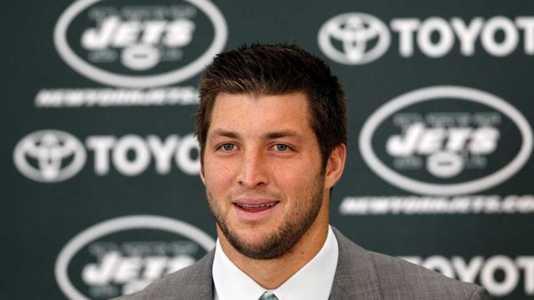 Quarterback Tim Tebow addresses the media as he is introduced...