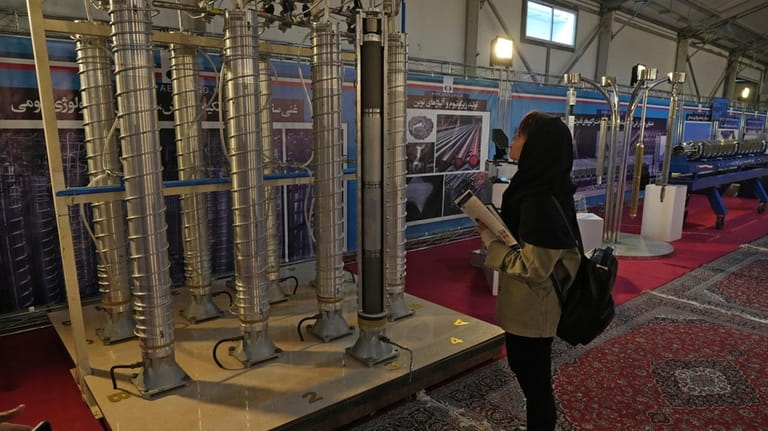 FILE -A student looks at Iran's domestically built centrifuges in...
