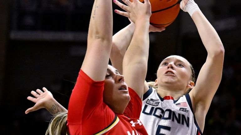 UConn guard Paige Bueckers (5) shoots over Maryland guard Faith...