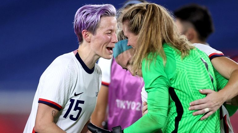 Megan Rapinoe #15 and Alyssa Naeher #1 of Team USA...