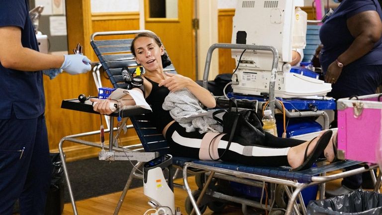 Kaila Passalatqua, of Farmingville, donates blood in honor of Nick...