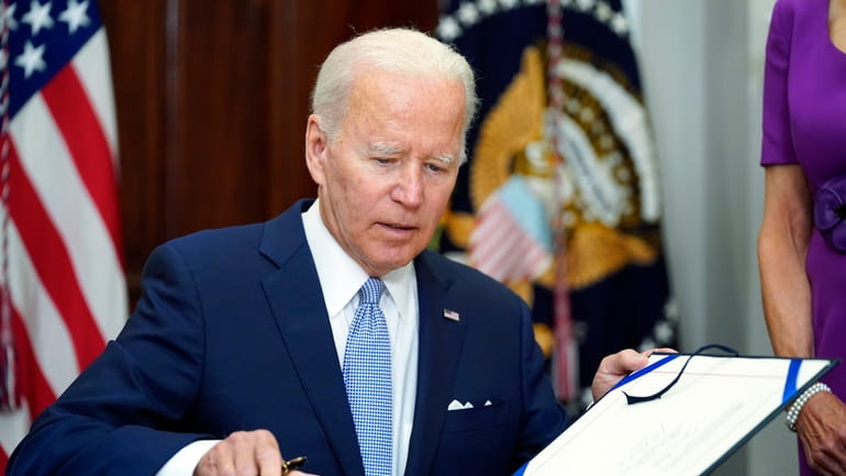 President Joe Biden signs into law S. 2938, the Bipartisan...