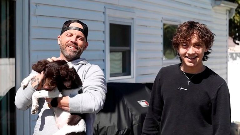 Sal Gomez, holding Winston, with his son Tyler, who received a kidney from...