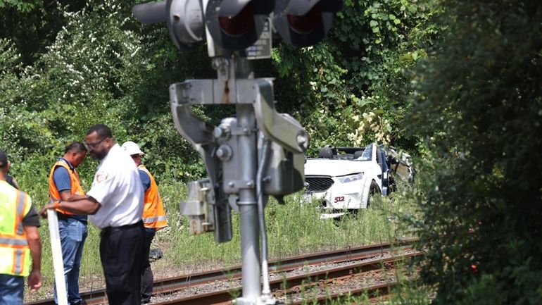 The scene where an LIRR train hit a taxi while crossing gates were...