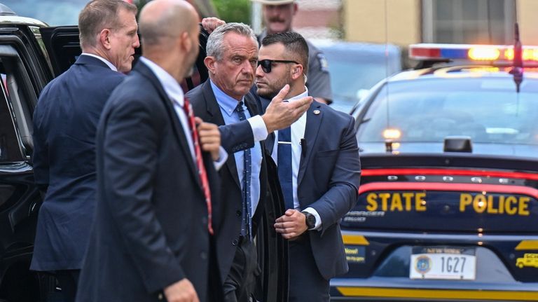 Independent presidential candidate Robert F. Kennedy Jr., center, arrives at...