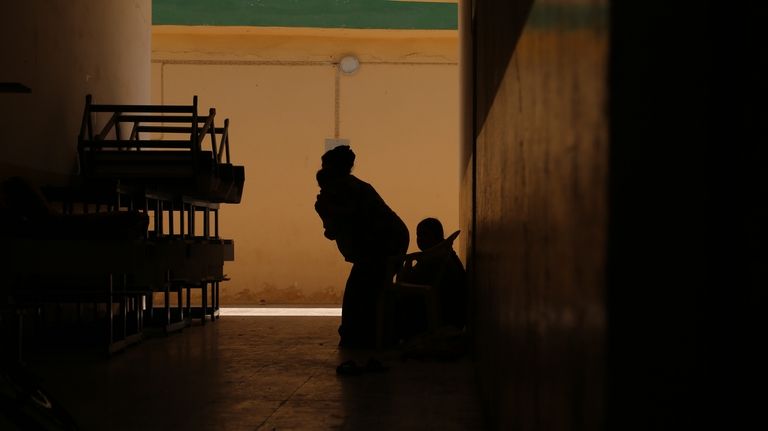 A Yazidi returnee family lives inside a school since they...