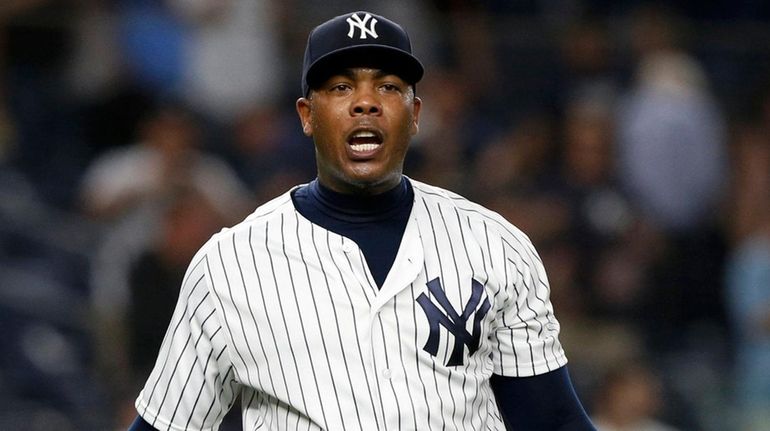 Yankees closer Aroldis Chapman reacts after the final out of...