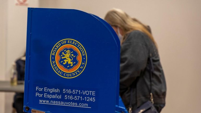 A voter casts her ballot in 2021 at the West...