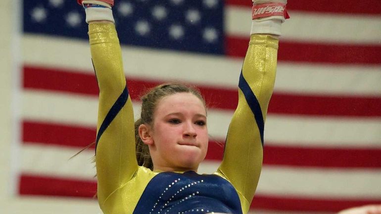 Bethpage gymnast Lexi Fraher performs on the uneven bars. (Feb....