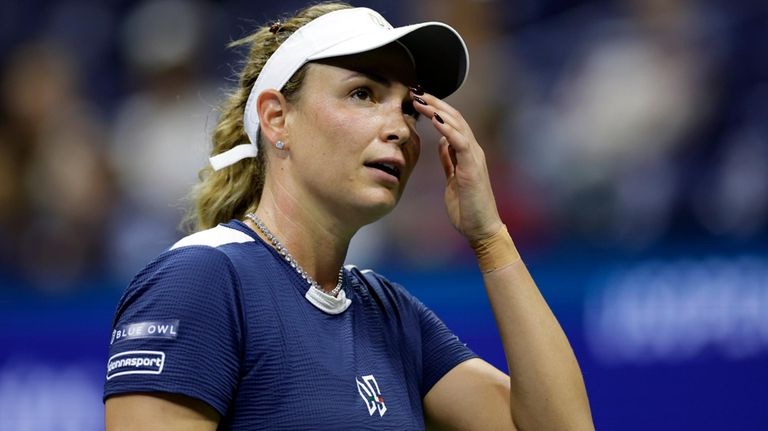 Donna Veki, of Croatia, reacts against Zheng Qinwen, of China,...