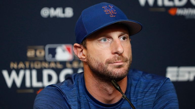 New York Mets starting pitcher Max Scherzer answers questions from...