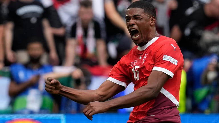 Switzerland's Kwadwo Duah celebrates after scoring his side's opening goal...