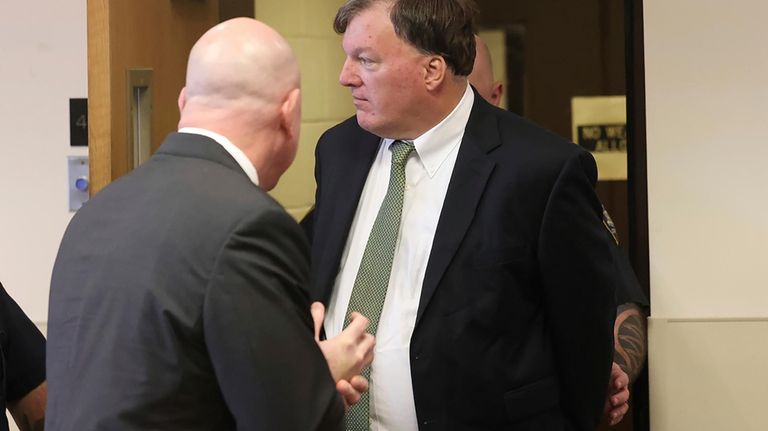 Rex A. Heuermann, right, appears in Suffolk County Court in...