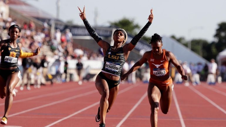 LSU's Sha'Carri Richardson, center, celebrates as she wins the women's...