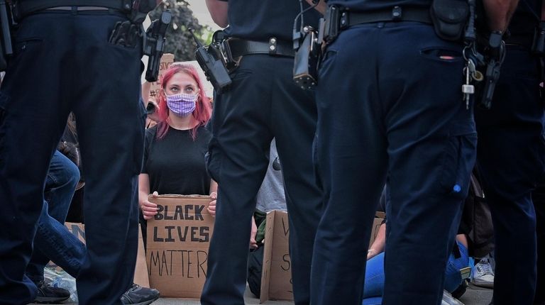 Dozens show up to protest for Black Lives Matter in...