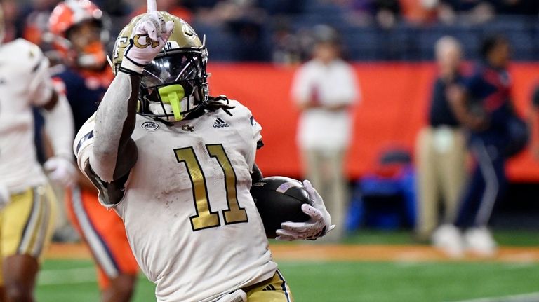 Georgia Tech running back Jamal Haynes (11) celebrate a touchdown...