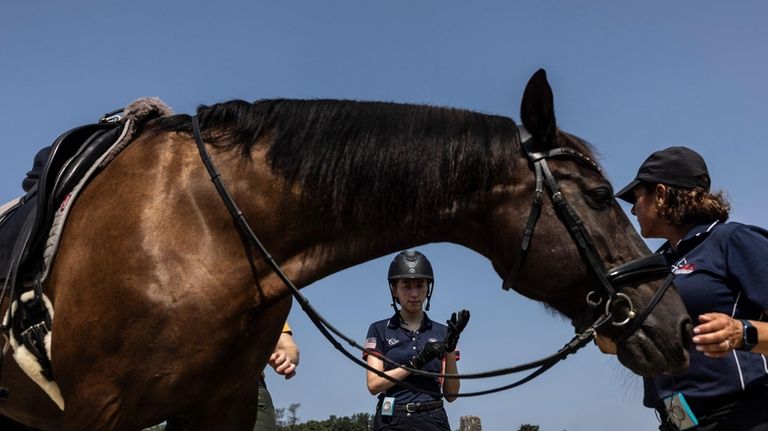 Para-equestrian Genevieve Rohner, during a training session with Ana O'Brien,...