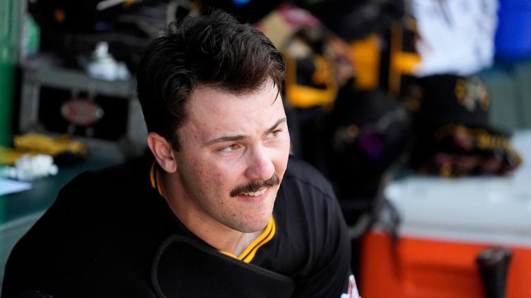 Pittsburgh Pirates starting pitcher Paul Skenes looks out from the...