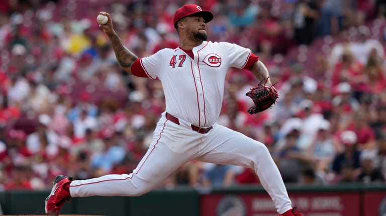 Cincinnati Reds starting pitcher Frankie Montas throws in the first...