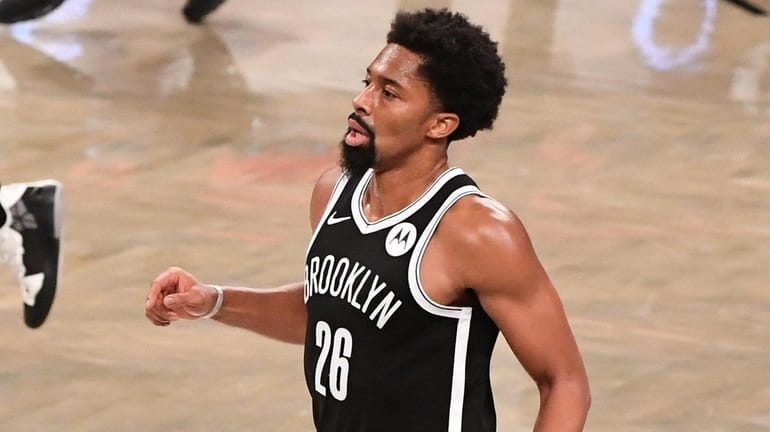 Nets guard Spencer Dinwiddie brings the ball up court against...