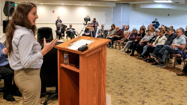 Holbrook resident Gabrielle Corso speaks during a public meeting about...