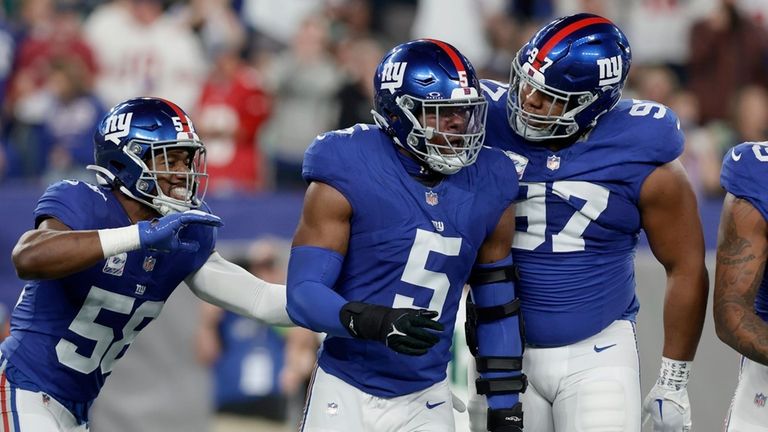 Kayvon Thibodeaux of the Giants celebrates his sack during the...