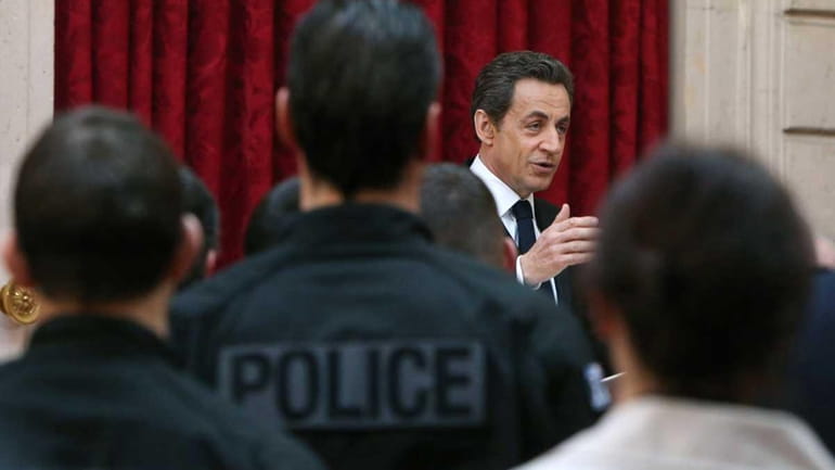 French President Nicolas Sarkozy delivers a speech to magistrates and...