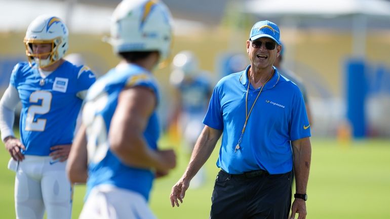 Los Angeles Chargers head coach Jim Harbaugh instructs on the...