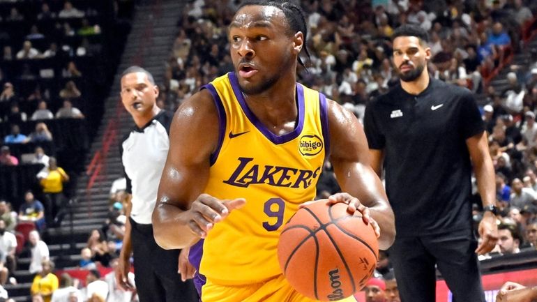 Los Angeles Laker guard Bronny James Jr. (9) drives the...