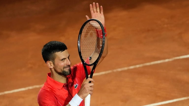 Serbia's Novak Djokovic celebrates after winning a match against France's...