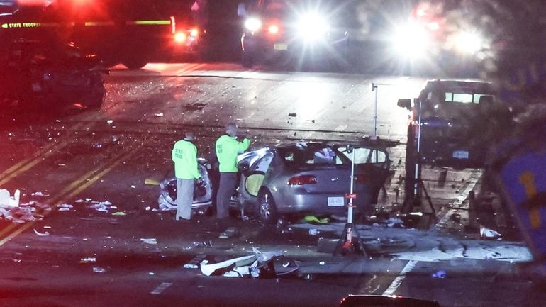 Riverhead police investigate a multivehicle crash on Cross River Drive...