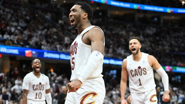 Cleveland Cavaliers' Donovan Mitchell (45) celebrates an offensive foul against...