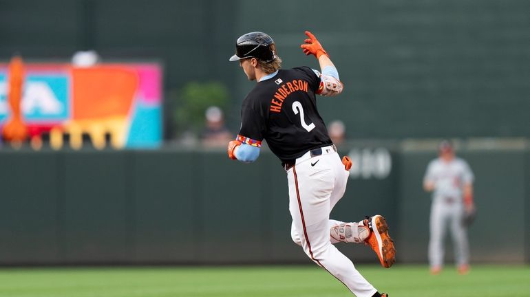 Baltimore Orioles' Gunnar Henderson (2) rounds the bases after hitting...