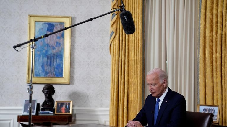 President Joe Biden pauses before he addresses the nation from...