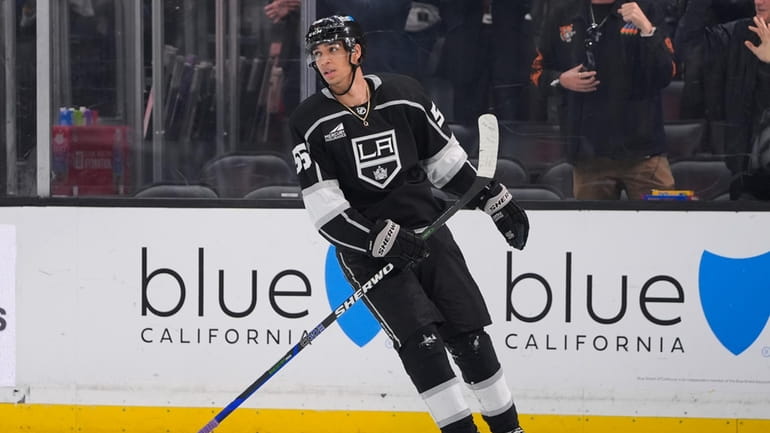 Los Angeles Kings right wing Quinton Byfield skates after scoring...