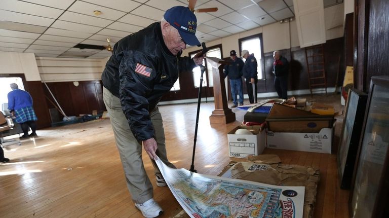 Knights of Columbus member and Korean War veteran Tom Aloisi looks over...